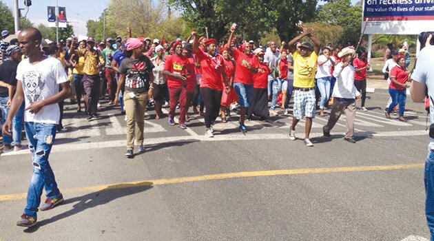 Protesting university students … A wave of often violent protests by students last year forced university authorities to scrap planned fee hikes 