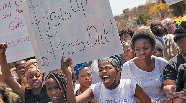 ‘Fists up, fros out’ -- University of Pretoria students and former Pretoria High School for Girls students protest outside the high school amidst claims of racism. (Pic:Greg Nicolson) 